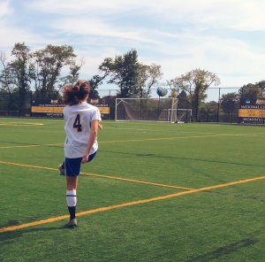 Number 4, Valentina Corasaniti taking a shot on goal during the team warmup before the start of the game. 